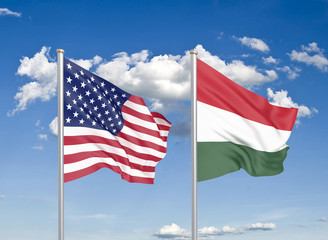 United States of America vs Hungary. Thick colored silky flags of America and Hungary. 3D illustration on sky background. - Illustration