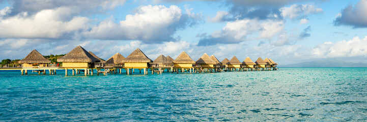 Overwater bungalows at a luxury beach resort in the tropics