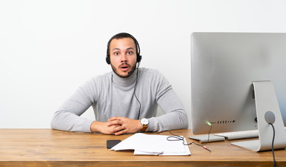 Telemarketer Colombian man with surprise facial expression