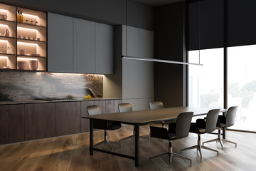 Gray kitchen corner with table and shelves