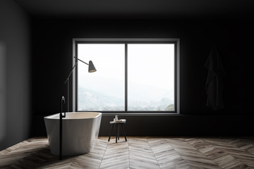 Fototapeta na wymiar Gray bathroom with tub and window