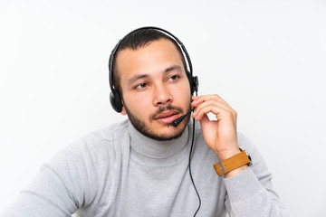 Telemarketer Colombian man working in a office