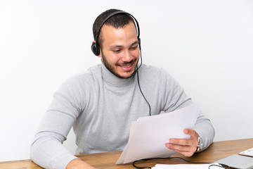 Telemarketer Colombian man working in a office