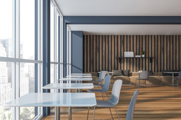 Gray and wooden restaurant interior with sofas