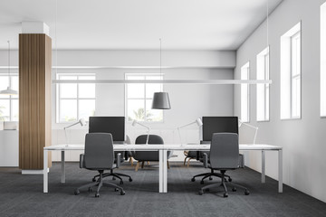 Modern office workplace with wooden columns