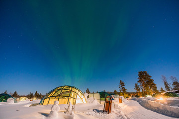 Northern lignt in Finland over Igloo house  - obrazy, fototapety, plakaty