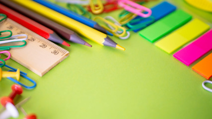 Stationery on green background