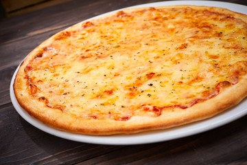 pizza on the wooden background