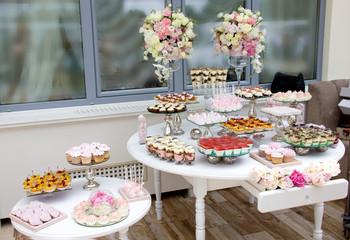 decorations for the wedding ceremony, candy bar, restaurant decoration for the wedding, desserts on the tables and wedding decorations