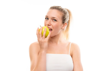 Young blonde woman over isolated white background with an apple