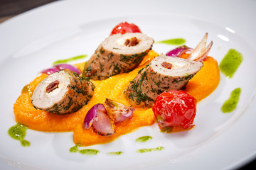 stuffed chicken fillet on the wooden background