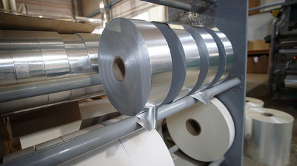 Shiny foil rolls for cigarettes packing in a tobacco factory