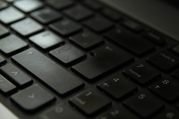 typing on a laptop computer keyboard close up