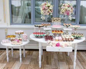 decorations for the wedding ceremony, candy bar, restaurant decoration for the wedding, desserts on the tables and wedding decorations