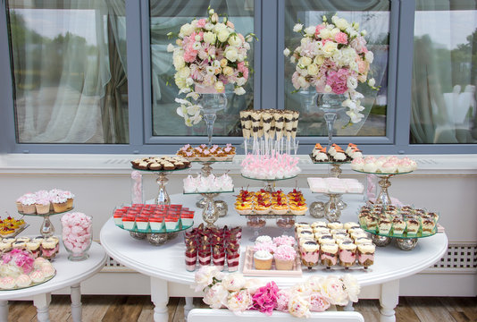 decorations for the wedding ceremony, candy bar, restaurant decoration for the wedding, desserts on the tables and wedding decorations