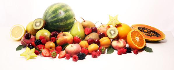 Fresh summer fruits with apple, peach, papaya, berries, pear and apricot.