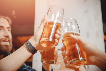 Closeup of glasses beer in bar. Party of friends