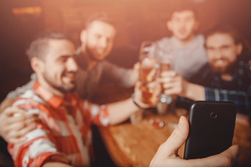 Selfie photo friends men hipsters in bar with beer at phone