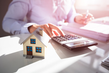 Businessperson Calculating Property Tax