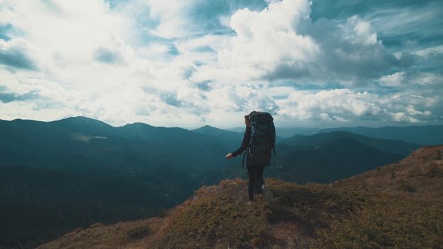 The man and woman walking on the beautiful mountain
