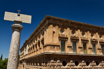 Obraz premium Pillar with latin inscription at church of Saint Mary beside Charles V Palace in Alhambra Granada
