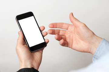Hand holding and Touch on Black Smartphone with blank screen on white background