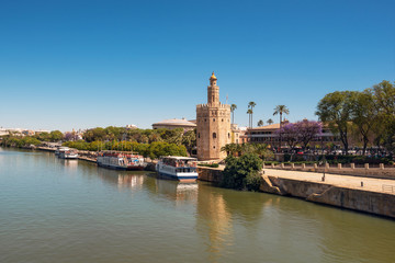 Golden tower Torre del Oro along the Guadalquivir river, Seville Andalusia , Spain .