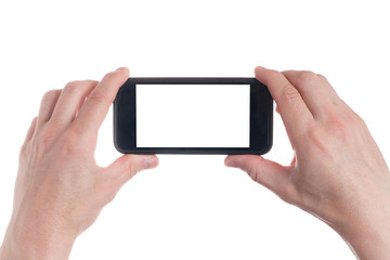 Hand holding black Smartphone with blank screen on white backgroun.