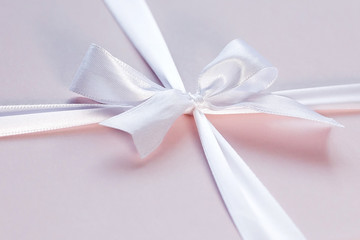 Pink box with white bow, a gift