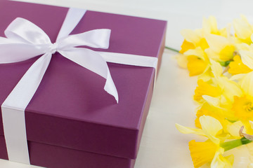 gift, purple box with white ribbon and yellow flowers