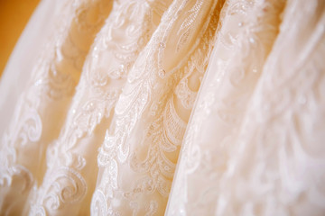 white lace embroidered with stones and rhinestones. luxury wedding dress.