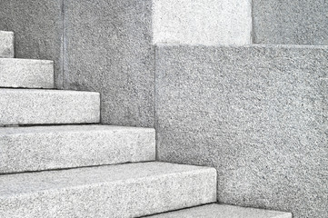 The edges and corners of the stone granite stairs. Concrete fragments of steps architecture...