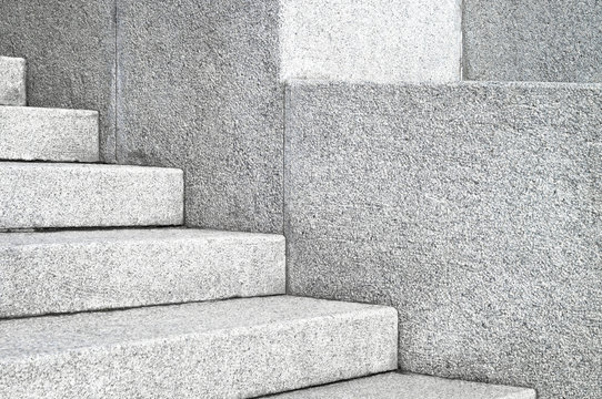 The edges and corners of the stone granite stairs. Concrete fragments of steps architecture close-up.