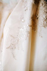white lace embroidered with stones and rhinestones. luxury wedding dress.