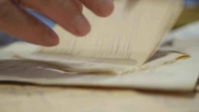 The Hands Of An Elderly Man Sorted Out Old Letters.