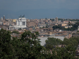 Rome cityscape with the Altar of the Fatherland (also known as Vittoriano or Vittorio Emanuele II Monument) on background