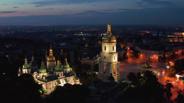 Aerial view of the St. Sophia Cathedral, illuminated at night, the monument to Bogdan Khmelnitsky and the center of Kiev