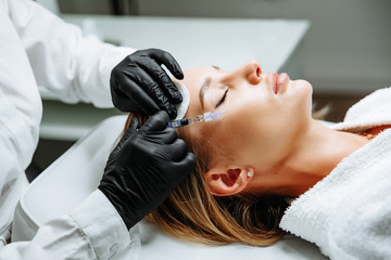 Portrait of female patient having modern noninvasive procedure of rhinoplasty, - 269743709