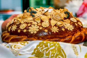 Wedding loaf lays on a wedding towel