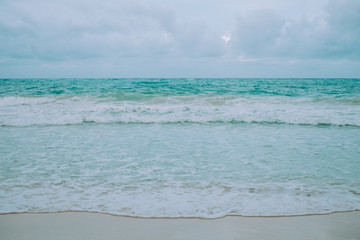 Sea waves on the beach front. Horizon over water. Selective focus. Copy space. 