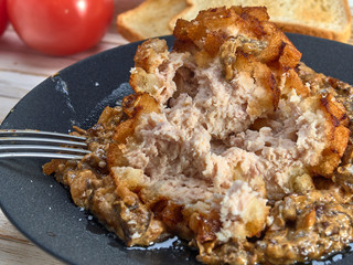 Delicious fried Patty of chicken meat, Pozharskaya.With creamy mushroom sauce.Fresh vegetable salad.Fried toast.