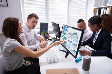 Businesswoman Showing Their Successful Teamwork On Computer