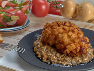 Delicious fried Patty of chicken meat, Pozharskaya.With creamy mushroom sauce.Fresh vegetable salad.Fried toast.
