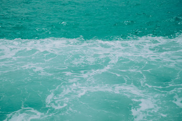 Water, ripple, waves and foam. Selective focus. Copy space. Closeup. Minimalist.