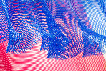 Colorful chain link curtain blowing in the wind