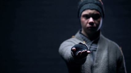 Homeless person stretching hand, begging for money, poverty problem, charity