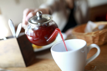 Person pouring fruit tea