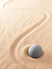 Muurstickers Zen meditation stone to focus and concentrate for a quiet peace of mind. Spiritual raked sand background texture. Concept for harmony purity and spirituality. . © kikkerdirk