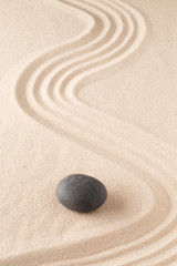 Fototapeta na wymiar meditation stone in Japanese zen garden. Concept for focus and concentration to reach spiritual balance, purity and harmony of mind and soul. Spa wellness or mindfulness background with copy space. .
