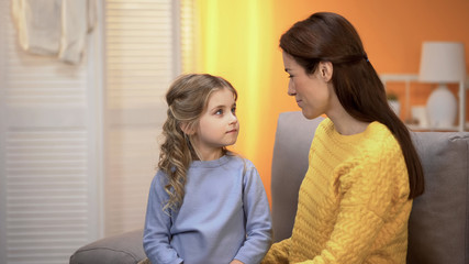 Mother and daughter looking at each other with love, support and care, emotions